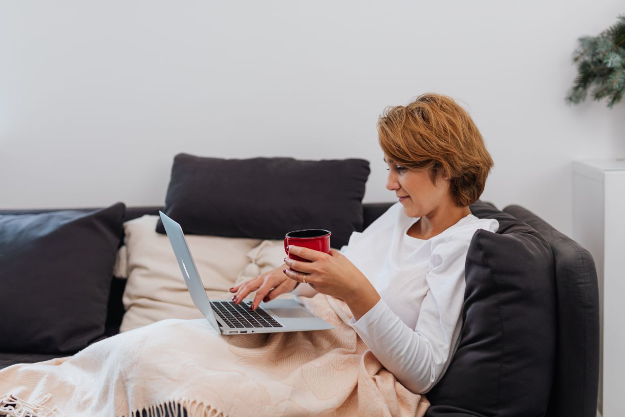 A constituent writing a personalized letter to their Member of Parliament on a laptop